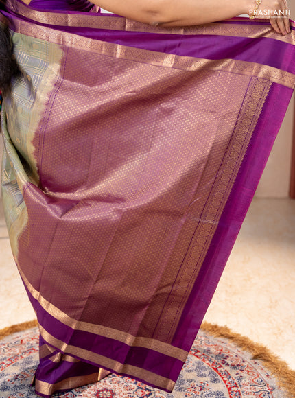 Pure kanchipuram silk saree pastel green and purple with allover zari checks& buttas and rettapet zari woven border