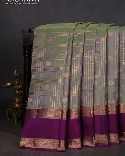 Pure kanchipuram silk saree pastel green and purple with allover zari checks& buttas and rettapet zari woven border