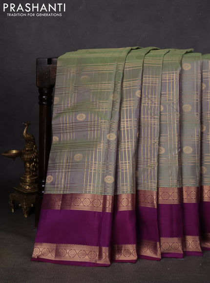 Pure kanchipuram silk saree pastel green and purple with allover zari checks& buttas and rettapet zari woven border