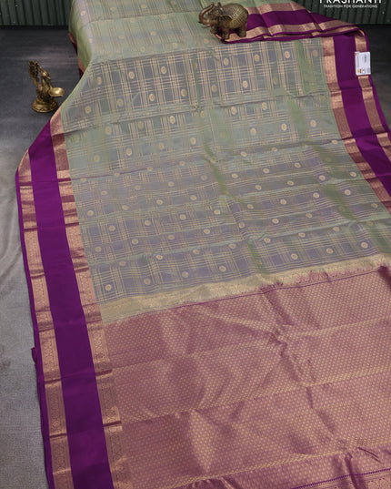 Pure kanchipuram silk saree pastel green and purple with allover zari checks& buttas and rettapet zari woven border