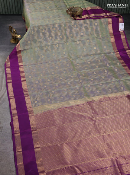 Pure kanchipuram silk saree pastel green and purple with allover zari checks& buttas and rettapet zari woven border
