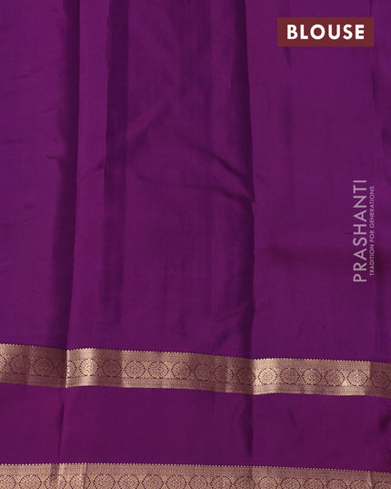 Pure kanchipuram silk saree pastel green and purple with allover zari checks& buttas and rettapet zari woven border