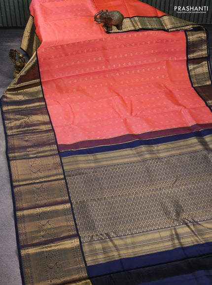 Pure kanchipuram silk saree peach shade and navy blue with allover zari stripes & buttas and long zari woven korvai border