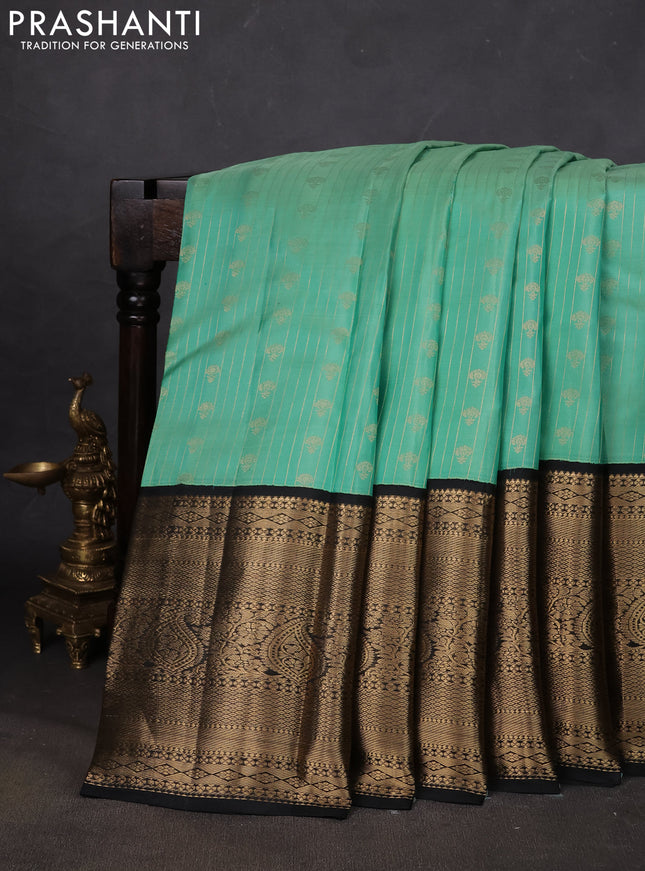 Pure kanchipuram silk saree teal green and black with allover zari stripes & buttas and long zari woven korvai border