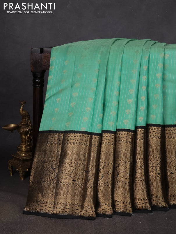 Pure kanchipuram silk saree teal green and black with allover zari stripes & buttas and long zari woven korvai border