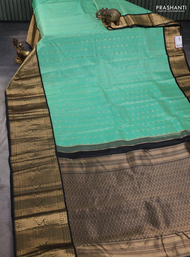 Pure kanchipuram silk saree teal green and black with allover zari stripes & buttas and long zari woven korvai border