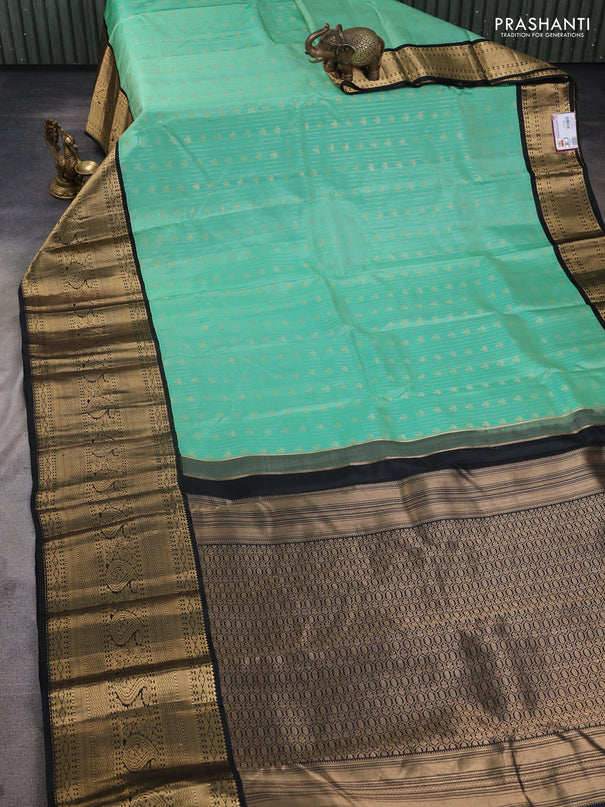 Pure kanchipuram silk saree teal green and black with allover zari stripes & buttas and long zari woven korvai border