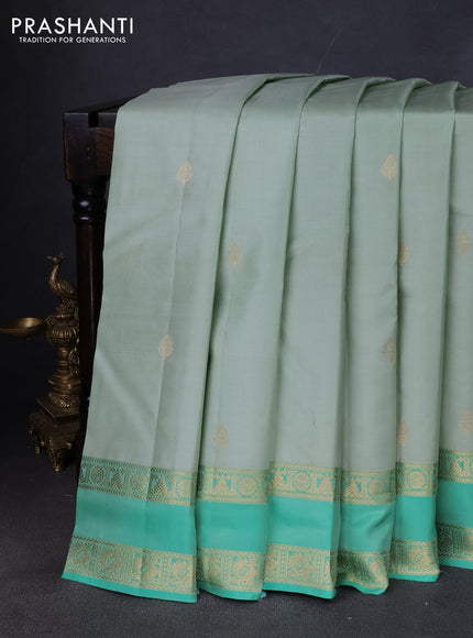 Pure kanchipuram silk saree pastel green and teal green with zari woven buttas and rettapet zari woven border