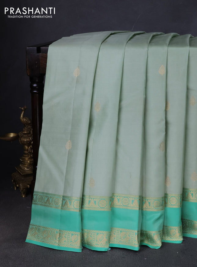 Pure kanchipuram silk saree pastel green and teal green with zari woven buttas and rettapet zari woven border