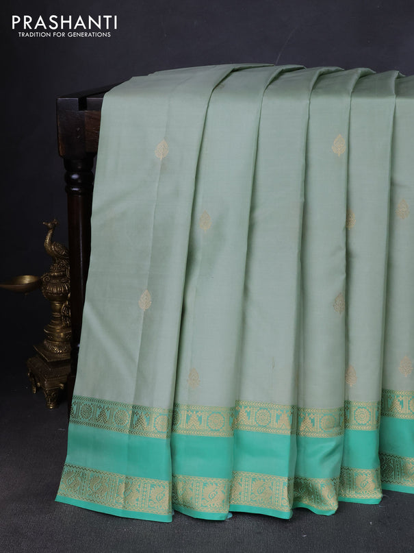 Pure kanchipuram silk saree pastel green and teal green with zari woven buttas and rettapet zari woven border