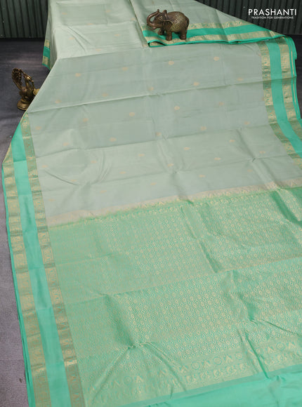 Pure kanchipuram silk saree pastel green and teal green with zari woven buttas and rettapet zari woven border