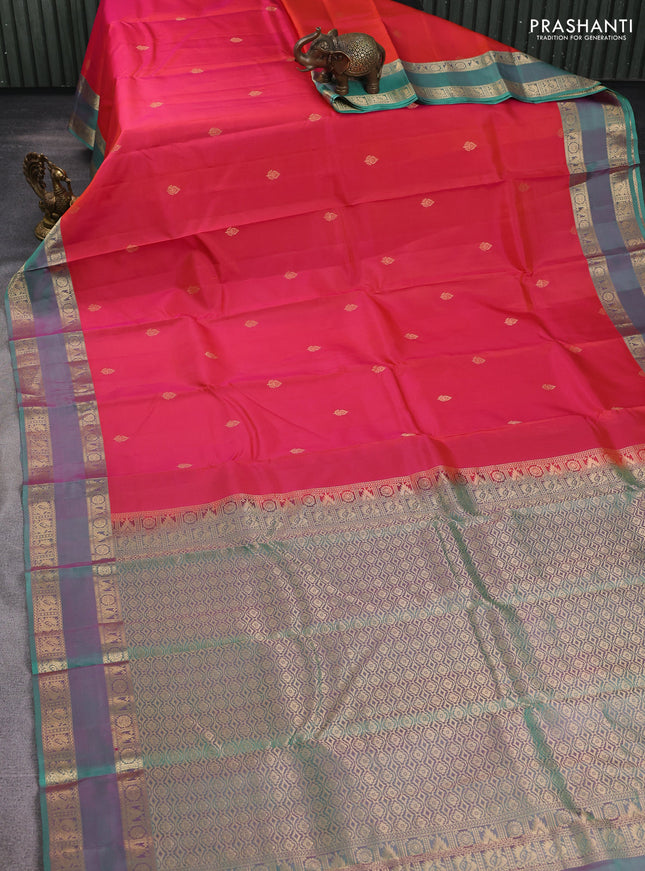 Pure kanchipuram silk saree dual shade of reddish pink and teal green with zari woven buttas and rettapet zari woven border