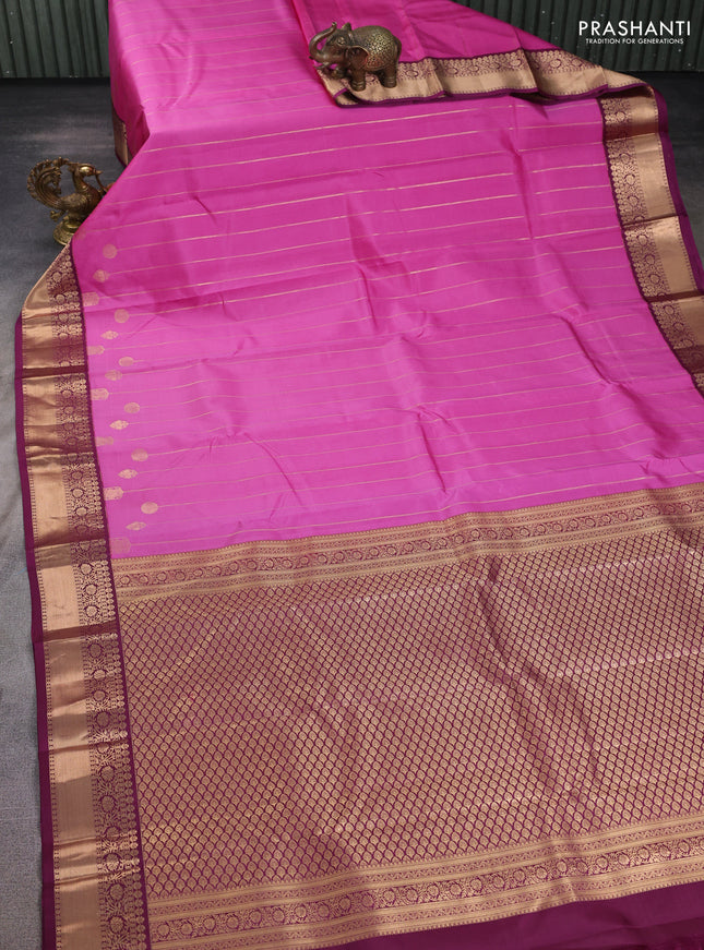 Pure kanchipuram silk saree pink and wine shade with allover zari weaves and zari woven korvai border