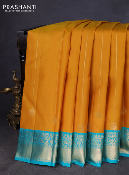 Pure kanchipuram silk saree yellow and teal green with allover zari stripes pattern and zari woven korvai border