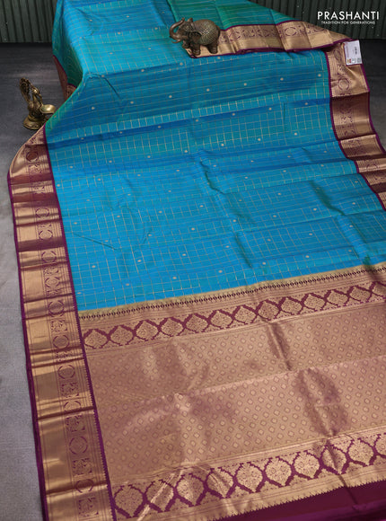 Pure kanchipuram silk saree dual shade of green and purple with allover zari checks & buttas and zari woven korvai border