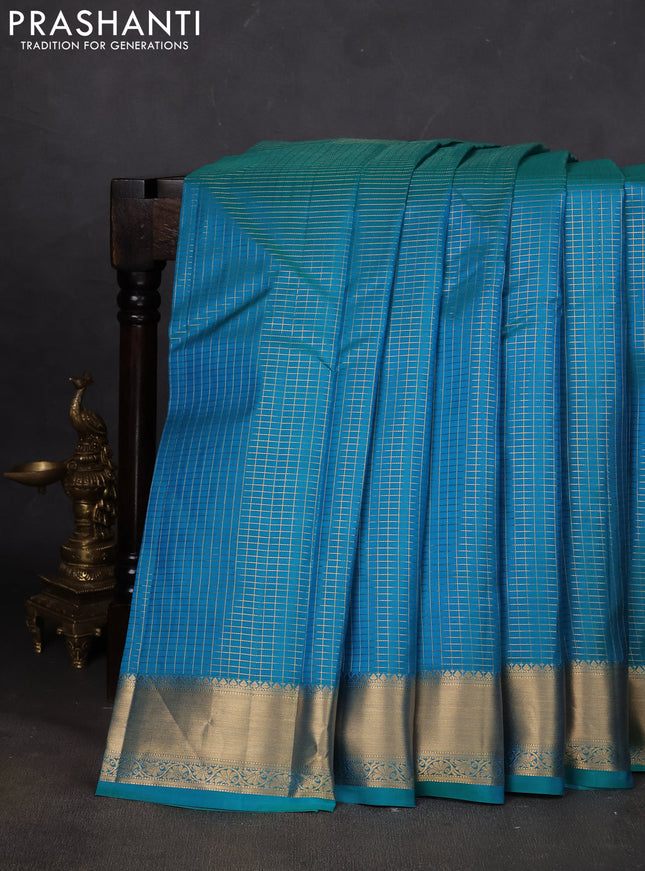 Pure kanchipuram silk saree teal blue with allover zari small zari checked pattern and zari woven border