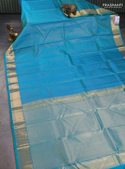Pure kanchipuram silk saree teal blue with allover zari small zari checked pattern and zari woven border