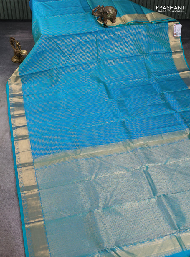 Pure kanchipuram silk saree teal blue with allover zari small zari checked pattern and zari woven border