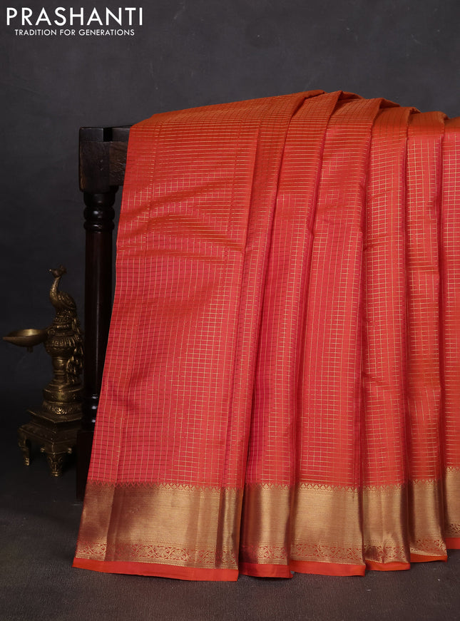 Pure kanchipuram silk saree orange with allover zari small zari checked pattern and zari woven border