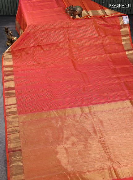 Pure kanchipuram silk saree orange with allover zari small zari checked pattern and zari woven border