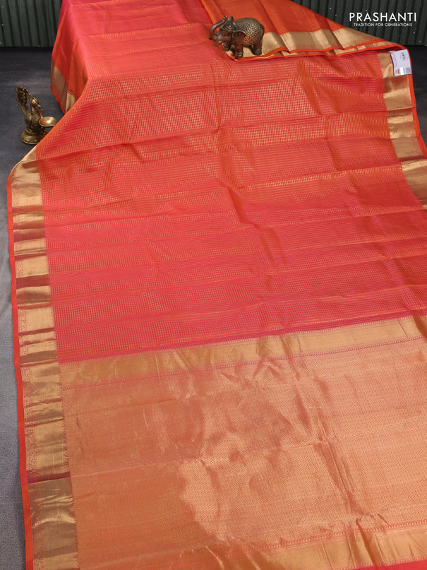 Pure kanchipuram silk saree orange with allover zari small zari checked pattern and zari woven border