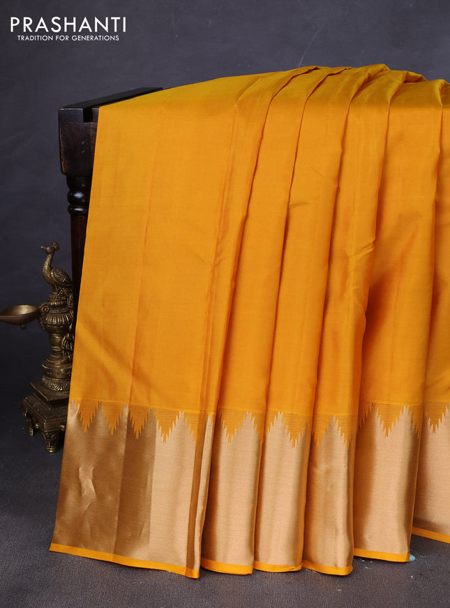 Pure kanchipuram silk saree mustard yellow with plain body and temple zari woven border