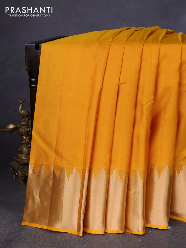 Pure kanchipuram silk saree mustard yellow with plain body and temple zari woven border