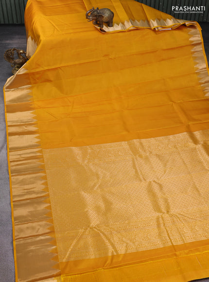 Pure kanchipuram silk saree mustard yellow with plain body and temple zari woven border
