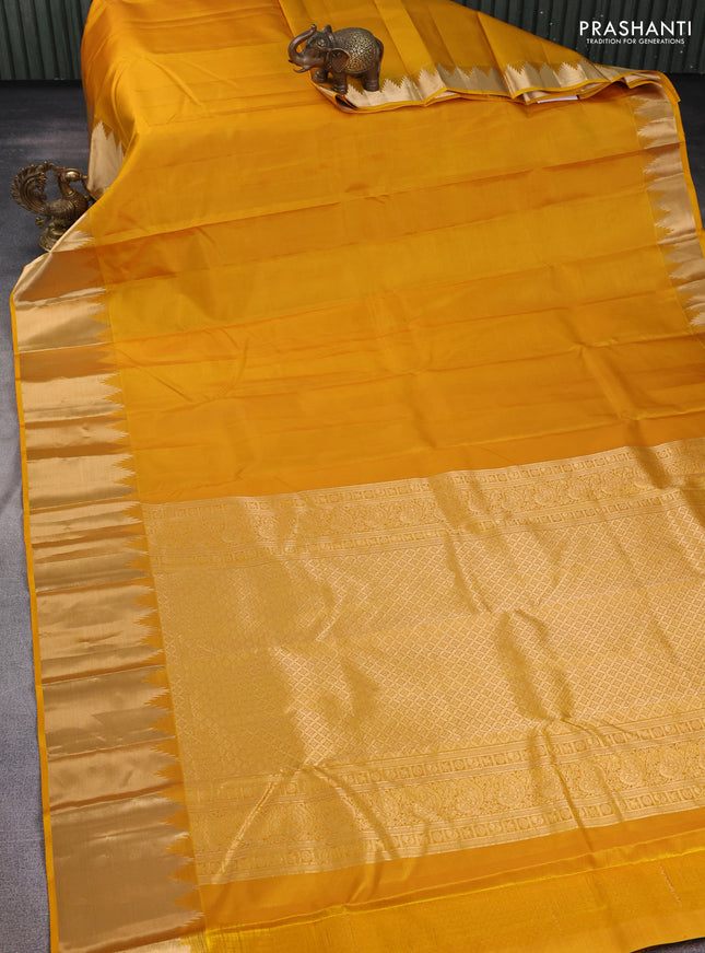 Pure kanchipuram silk saree mustard yellow with plain body and temple zari woven border