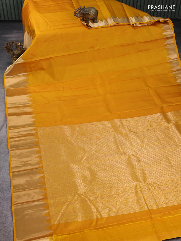 Pure kanchipuram silk saree mustard yellow with plain body and temple zari woven border