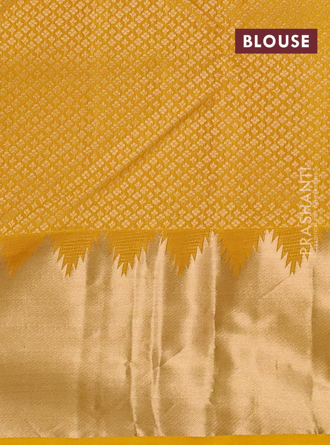 Pure kanchipuram silk saree mustard yellow with plain body and temple zari woven border
