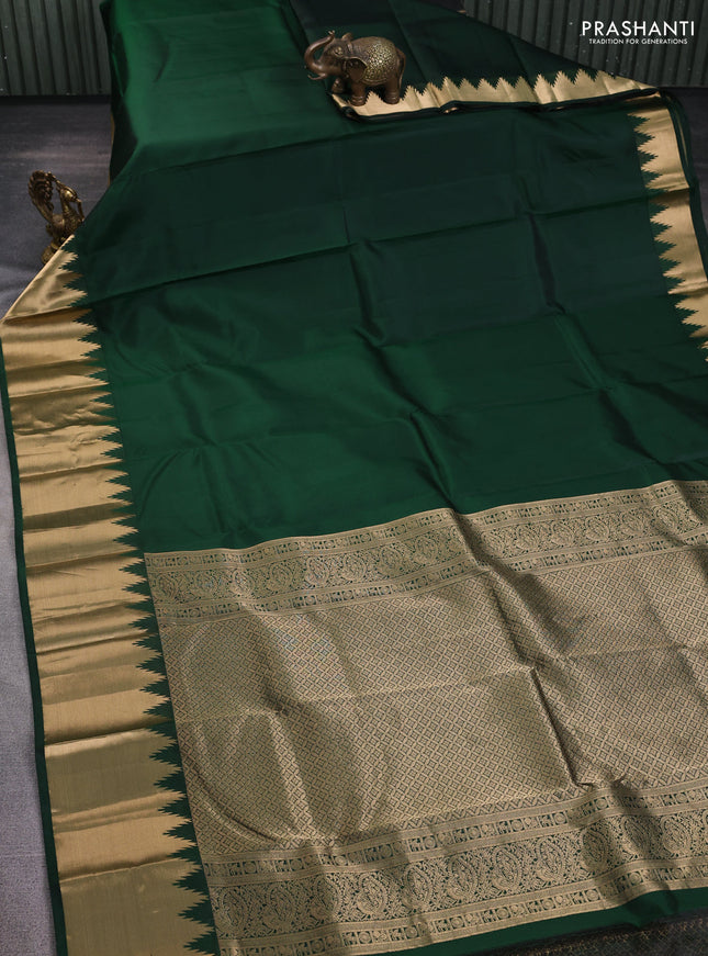 Pure kanchipuram silk saree bottle green with plain body and temple zari woven border