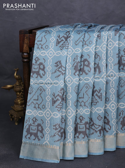 Munga tussar silk saree pastel blue with allover patola prints and zari woven border