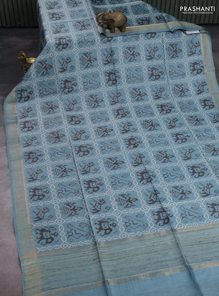 Munga tussar silk saree pastel blue with allover patola prints and zari woven border
