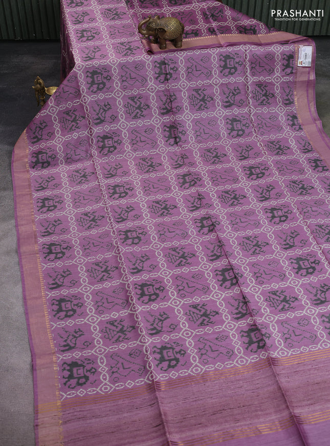 Munga tussar silk saree pastel purple with allover patola prints and zari woven border