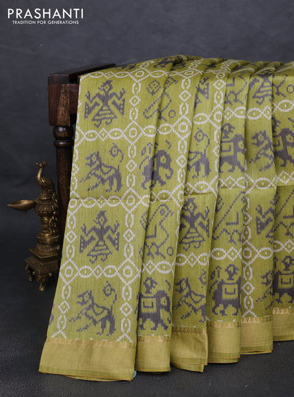 Munga tussar silk saree light green with allover patola prints and zari woven border