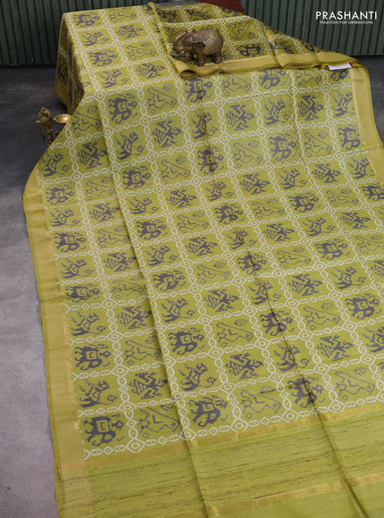 Munga tussar silk saree light green with allover patola prints and zari woven border