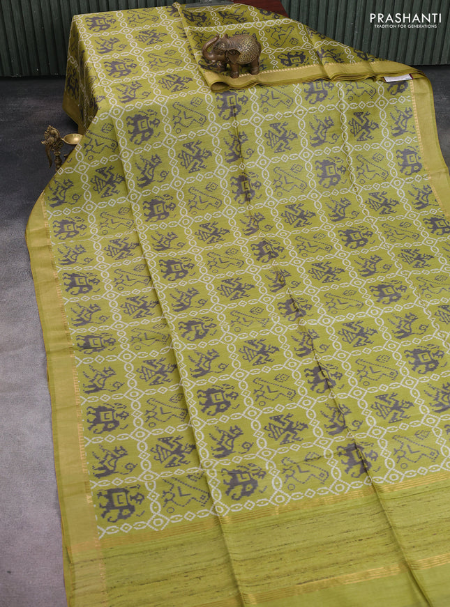 Munga tussar silk saree light green with allover patola prints and zari woven border