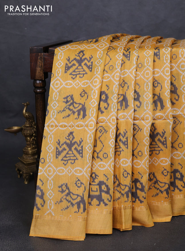 Munga tussar silk saree mustard yellow with allover patola prints and zari woven border