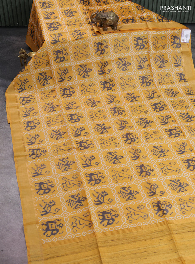 Munga tussar silk saree mustard yellow with allover patola prints and zari woven border