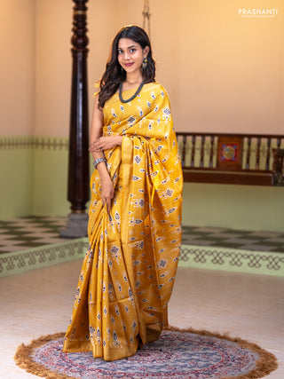 Munga tussar silk saree yellow with allover ikat butta prints and zari woven border
