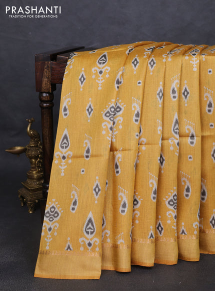 Munga tussar silk saree yellow with allover ikat butta prints and zari woven border
