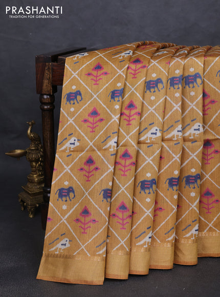 Munga tussar silk saree dark mustard with allover patola prints and zari woven border