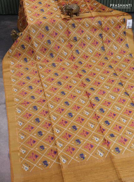 Munga tussar silk saree dark mustard with allover patola prints and zari woven border