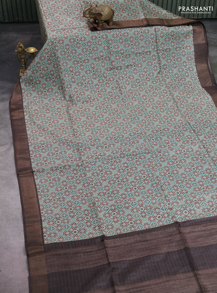 Munga tussar silk saree pastel brown teal blue and coffee brown with allover ajrakh prints and zari woven border