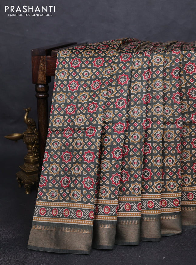 Munga tussar silk saree sap green shade with allover ajrakh prints and zari woven border