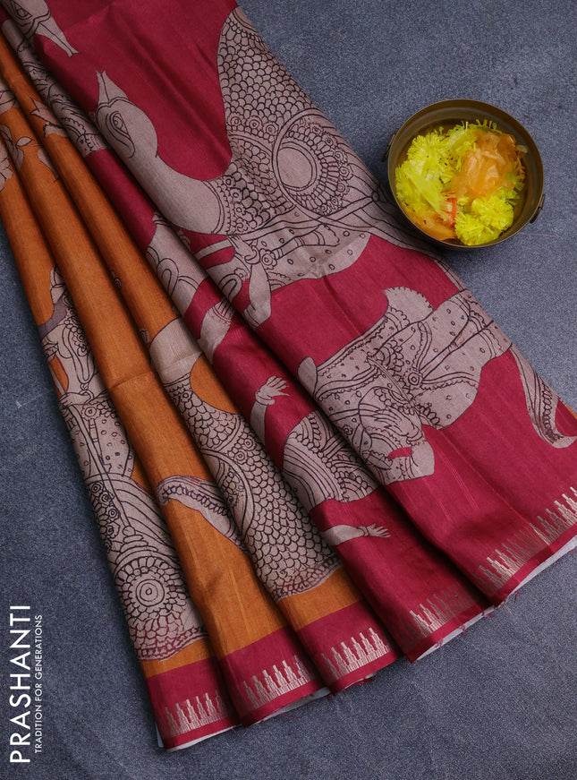 Semi matka saree orange and maroon with allover kalamkari prints and temple design zari woven border