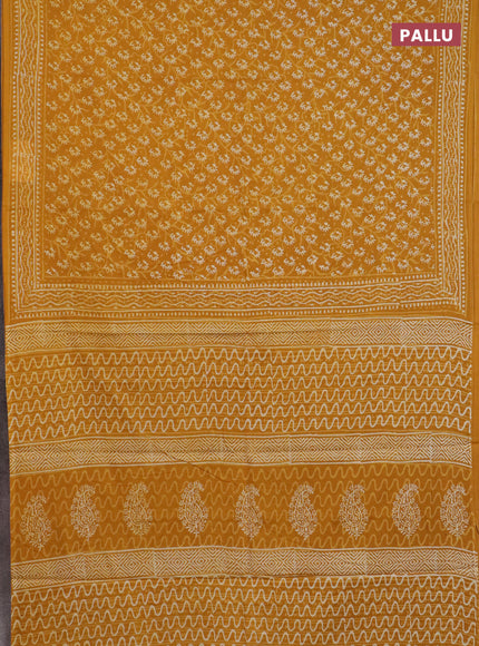 Jaipur cotton saree mustard yellow with allover dabu prints and printed border
