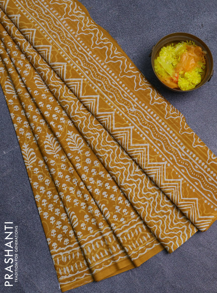 Jaipur cotton saree mustard yellow with allover dabu prints and printed border