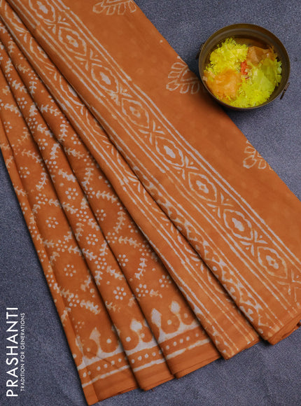 Jaipur cotton saree orange with allover batik prints and printed border